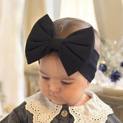 BABYGIZ handmade cotton headband in orange offers gentle stretch for delicate skin.