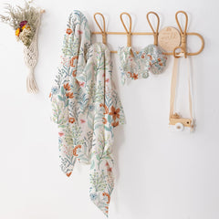 BabyWhale floral swaddle with hat shows coordinated newborn set for stylish photos