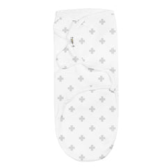 Infant wrapped snugly with adjustable Baebae Goods swaddle, safe and secure.