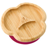 Bamboo Baby Divider Plate with suction base on a table to prevent spills during mealtime.