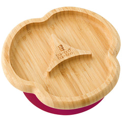 Bamboo Baby Divider Plate with suction base on a table to prevent spills during mealtime.