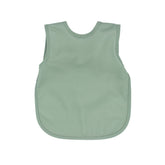 BapronBaby Minimalist Sage Bapron on a baby during meals, comfortable and stylish protection.