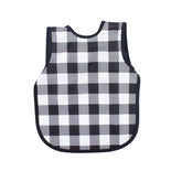 BapronBaby white buffalo plaid fabric close-up showing waterproof layer for mess-free meals.