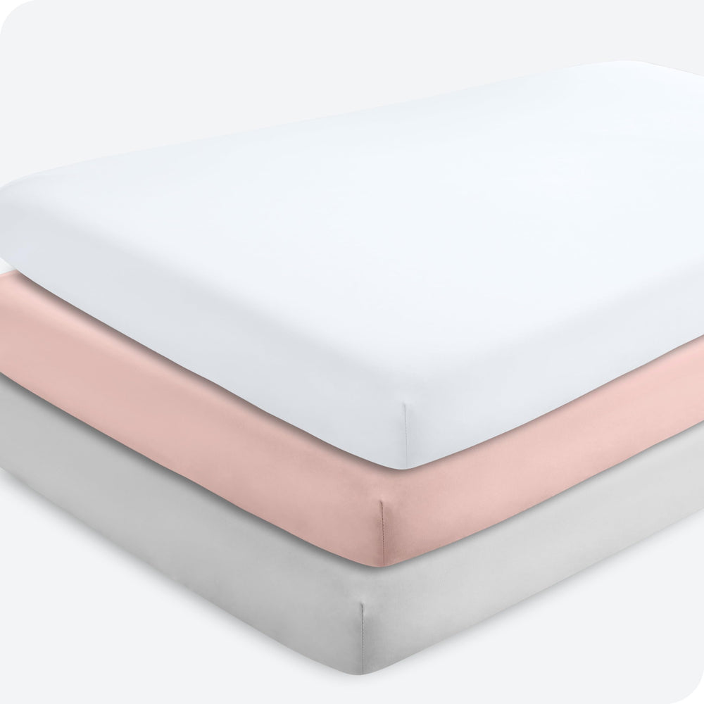 Bare Home pink slipper fitted crib sheet on mattress offers soft, breathable comfort.