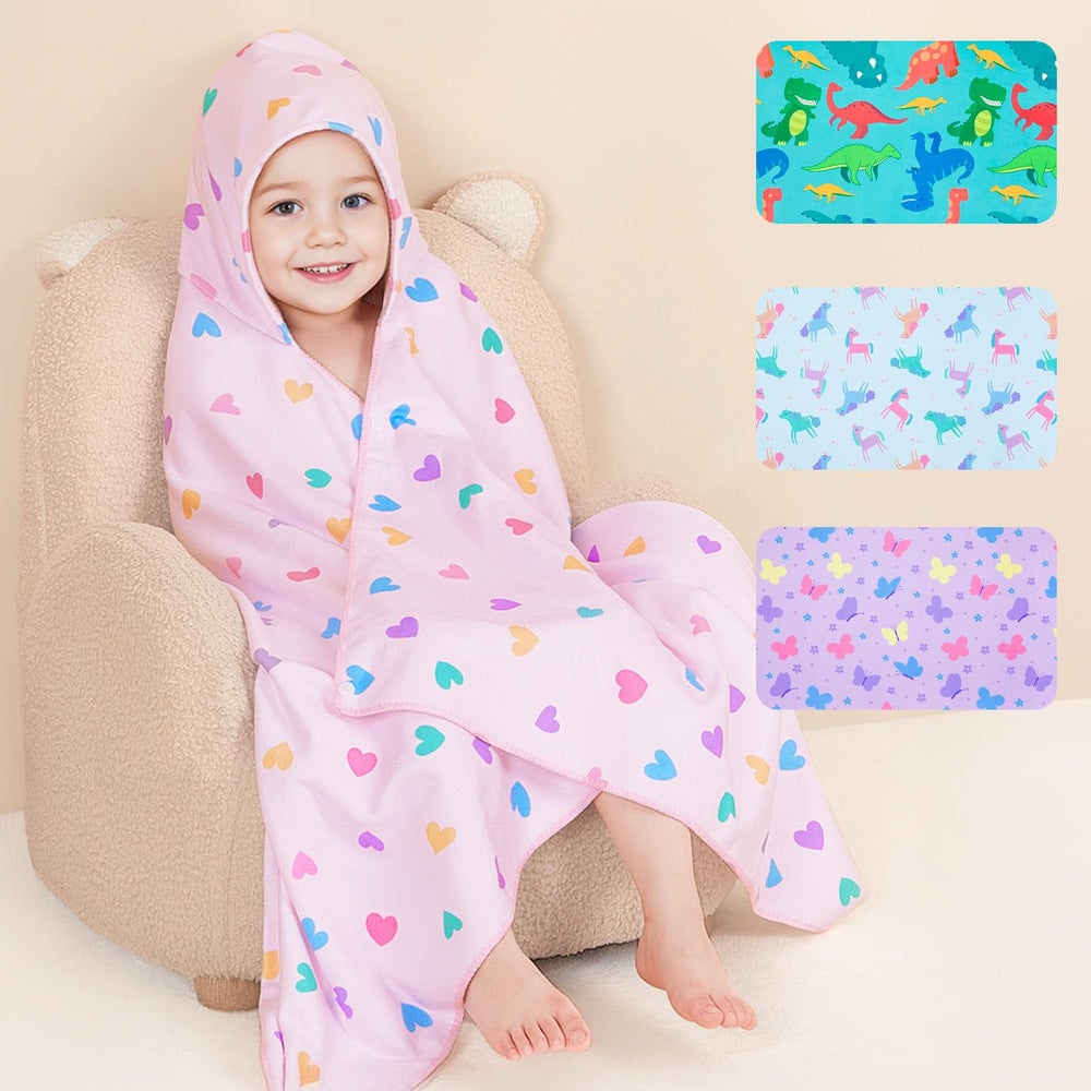Basumee toddler hooded towel with a dino pattern keeps little one warm after bath
