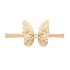 BBTDIN gold bow hairband adds charming detail to party-ready looks.