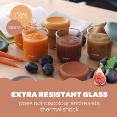 BEABA jars show clear ml/oz graduations for precise portioning and tracking.