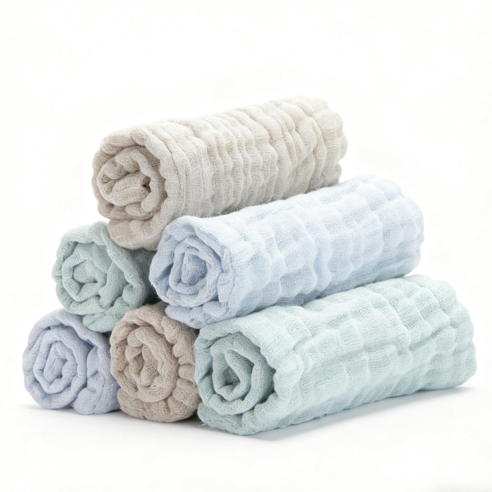 Bear Rocket organic muslin washcloths blue folded for gentle baby cleansing.