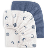 Bearmoss blue crescent muslin crib sheet on a standard crib mattress for breathable comfort.