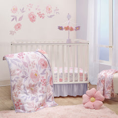 Bedtime Originals lavender floral quilt showing watercolor roses for a cozy nursery accent.