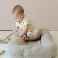 Beisurznga baby lounger in use during awake-time play.