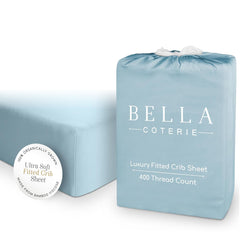 Bella Coterie coastal blue crib sheet folded, displaying silky bamboo viscose feel for sensitive skin.