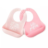 Bella Tunno Wonder Bib two-pack with crumb-pocket catching crumbs during feeding.