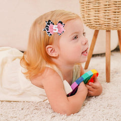 BESALECK ice cream glitter bow enhances festive hairstyles for little girls.