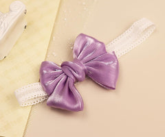 Bethynas toddler bow headband shines in photos with glitter detail