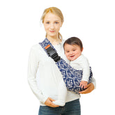 Beyoik baby sling carrier in blue sailboat worn for hands-free strolling and close bonding.
