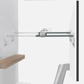 Bezant metal TV safety straps on the back of a TV for secure wall anchoring.