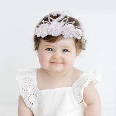 BFNAAgirl flower headband nylon with soft leaves and rhinestones for a gentle look.
