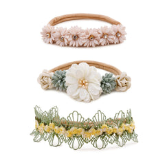 BFNAAgirl baby floral headband on nylon stretch band for gentle comfort.