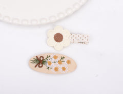 BIANHUAN embroidered-design hair clips with secure alligator grip for daily wear.