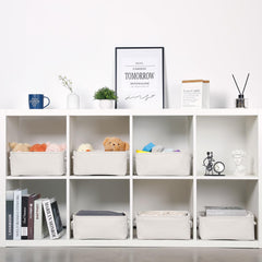 Bidtakay collapsible beige fabric storage bin shown folded and open.