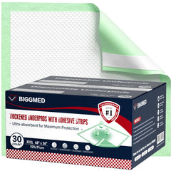 BIGGMED bed pad with adhesive strips on mattress for stable overnight protection.