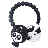 BIGSPINACH mummy teether with black bumpy ring eases teething discomfort for babies.