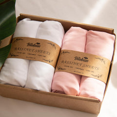 Biloban baby bassinet sheets in pink and white pack provide soft comfort for naptime.