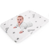 Biloban bassinet mattress pad on a Dream On Me Nest, providing a snug sleep surface.