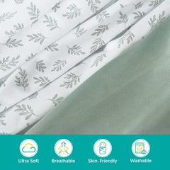 Biloban fitted bassinet sheet in green leaf for snug fit on various bassinet shapes.