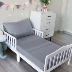 Biloban toddler sheet set fitted sheet on crib mattress for a secure, wrinkle-resistant fit.