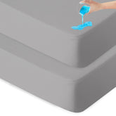 Biloban waterproof bassinet sheet 2-pack in grey protects the mattress from spills.