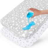 Biloban waterproof crib mattress protector on a crib mattress showing spill protection