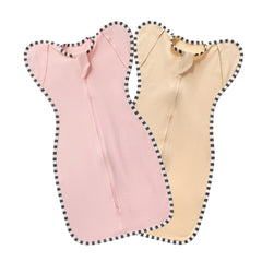 Blackleaf Baby swaddle with arm up design in pink and light apricot promotes secure, soothing sleep.