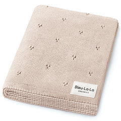 Bleu La La Pointelle Swaddle Blanket in oatmeal offers breathable, gentle comfort for delicate newborn skin.