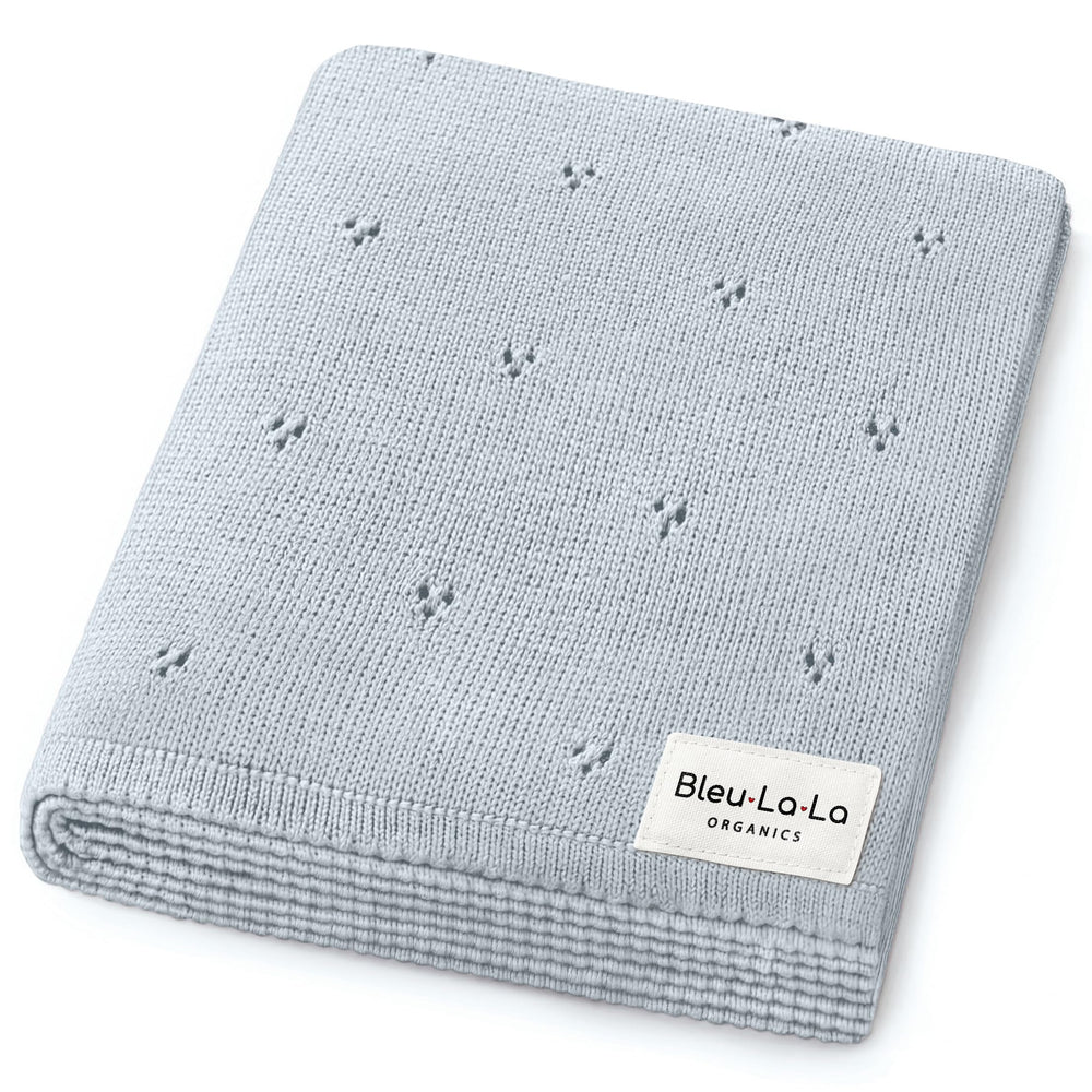 Bleu La La Pointelle swaddle in powder blue, ultra-soft organic cotton for delicate newborn skin.
