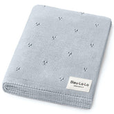 Bleu La La Pointelle swaddle in powder blue, ultra-soft organic cotton for delicate newborn skin.
