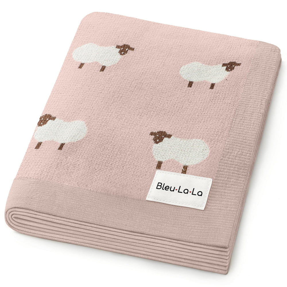 Bleu La La Sheep Knit Blanket in light pink close-up showing soft cotton texture for gentle touch.