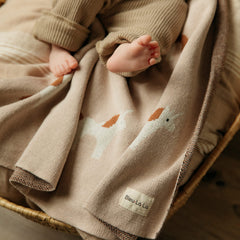 Bleu La La Unicorn Cream blanket in a nursery as soft decor.
