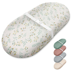 Blissful Diary botanical leaf changing pad with soft muslin cover for gentle diaper changes.