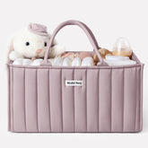 Blissful Diary diaper caddy with mauve pink handles for easy room-to-room transport.