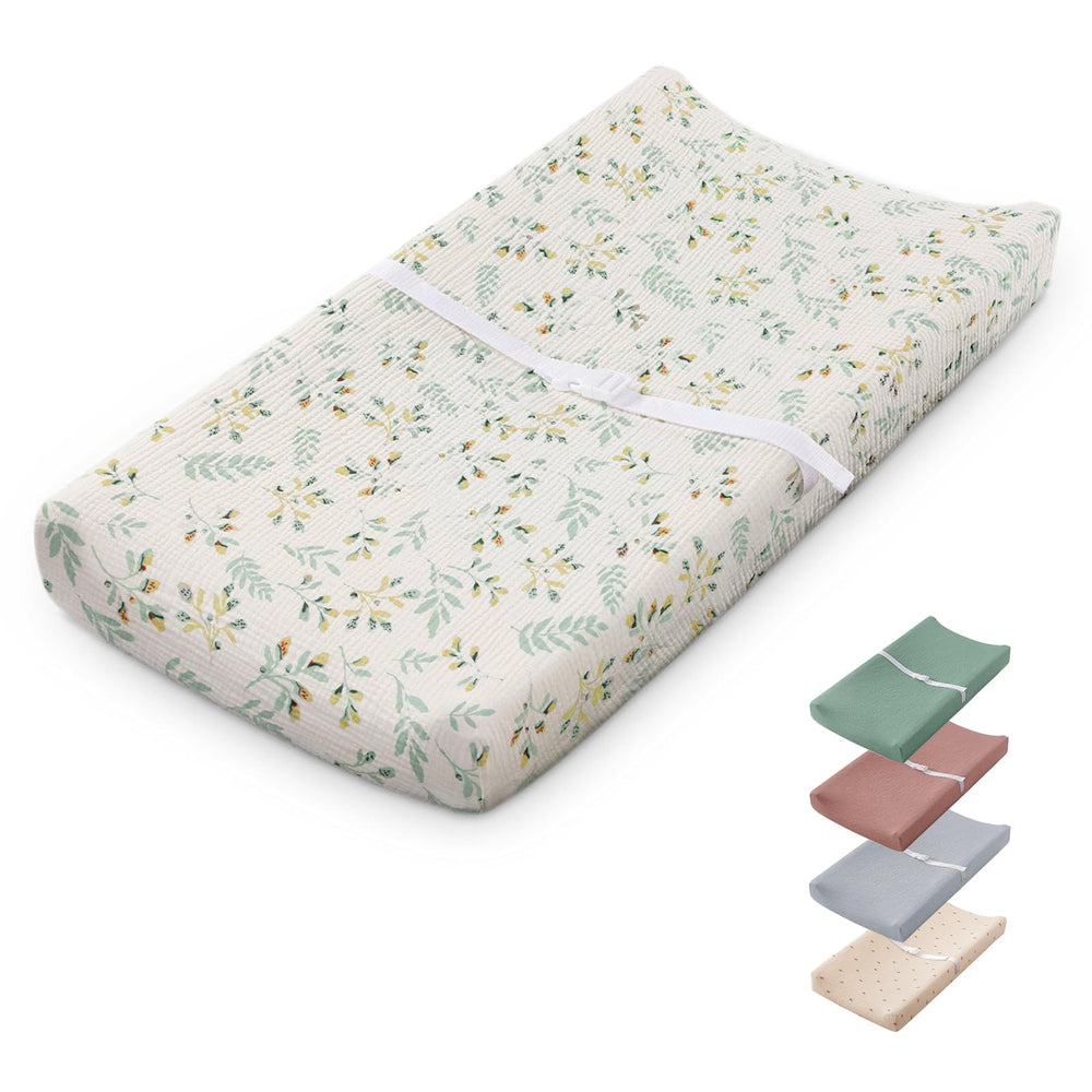 Blissful Diary changing pad with botanical leaf design, front view showing size and shape for nursery spaces
