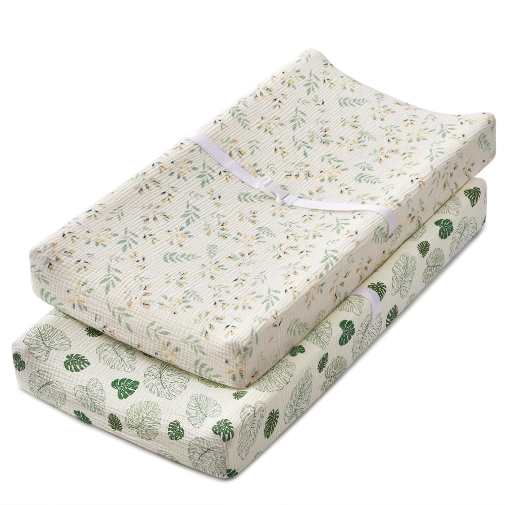 Blissful Diary leaf-print muslin changing pad cover for a soft, breathable changing surface.