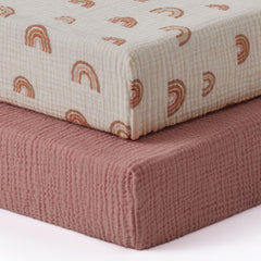 Blissful Diary dusty pink muslin crib sheet on crib mattress, breathable and gentle for baby comfort