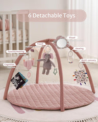 Rattle toy dangling from Blissful Diary gym arch to stimulate hearing and movement.