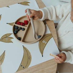 Blooom wipeable placemat demonstrates easy-clean surface for quick messes.