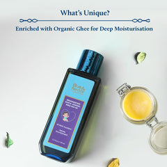 Blue Nectar oil being poured onto a baby's scalp for gentle nourishment.
