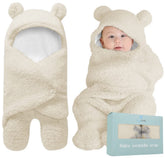 BlueMello baby swaddle blanket in beige with ultra-soft plush texture for newborn comfort.