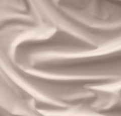 Close-up of the fitted crib sheet showing a secure top-stitched elastic band for snug fit.