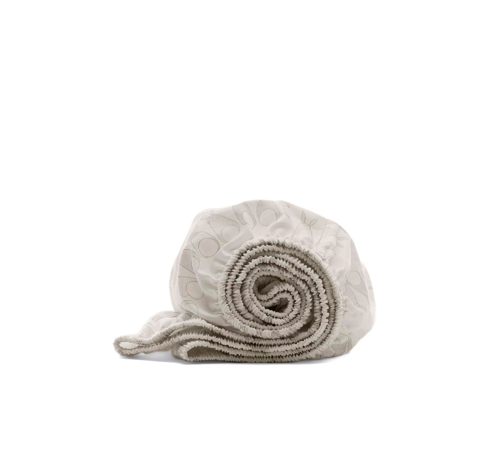 Boll & Branch Signature crib sheet shows soft texture for gentle newborn comfort.